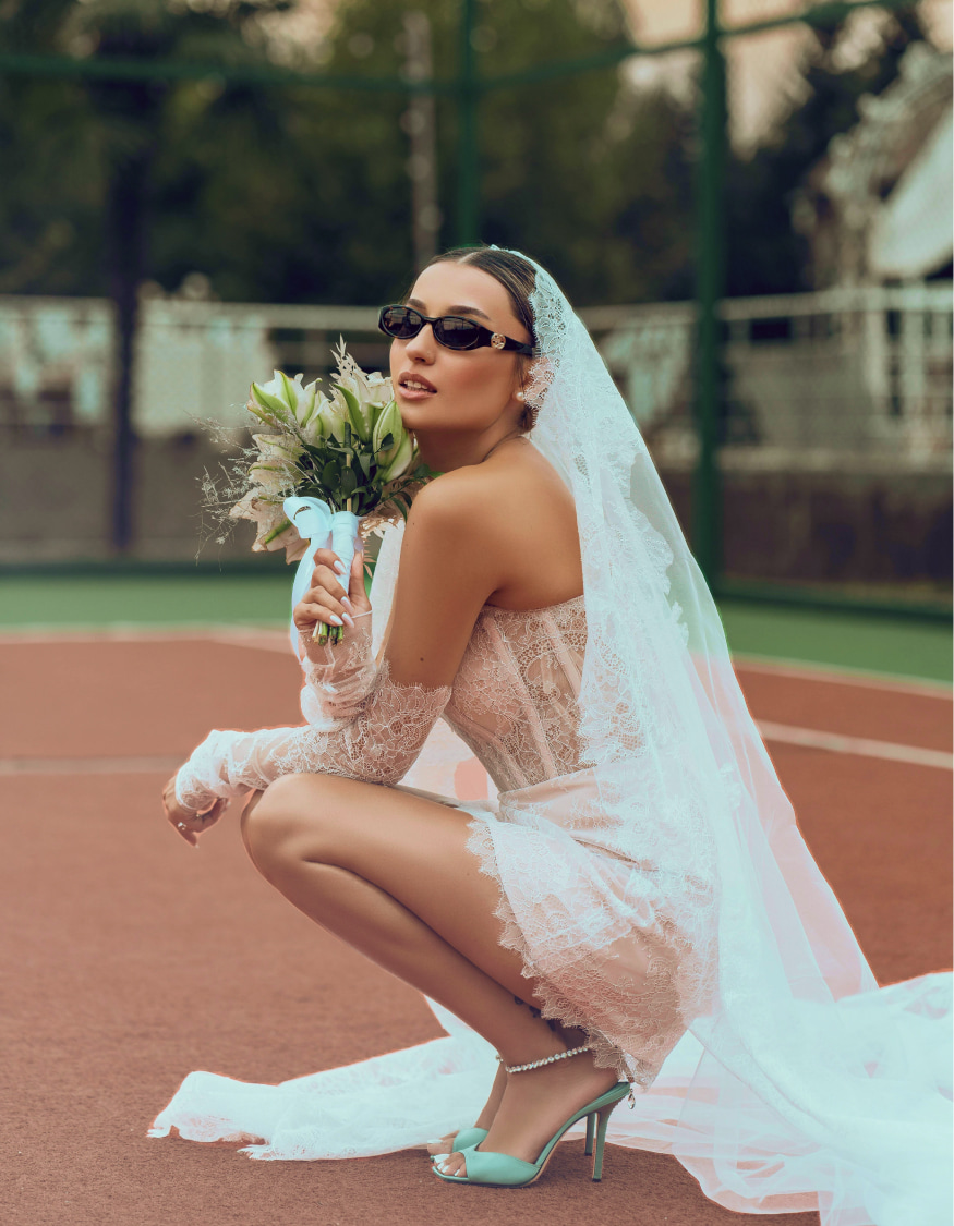 Photo of model wearing a white bridal gown on a scooter - desktop image